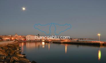 nice view of donnalucata from the harbour in the night