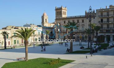 main ispica sqaure with old buildings and church