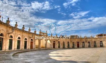 old open space market in front of basilica ispica