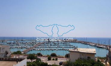 the harbour of marina di ragusa during the summer time