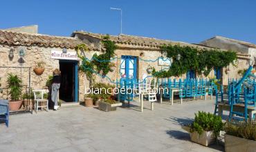 marzamemi main square full of shops and restaurant during the day