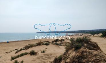 in sampiery long beach with sandy dunes and typical mediterranean flora