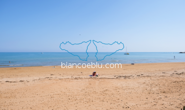 free sandy beach and light blue sea marina di ragusa